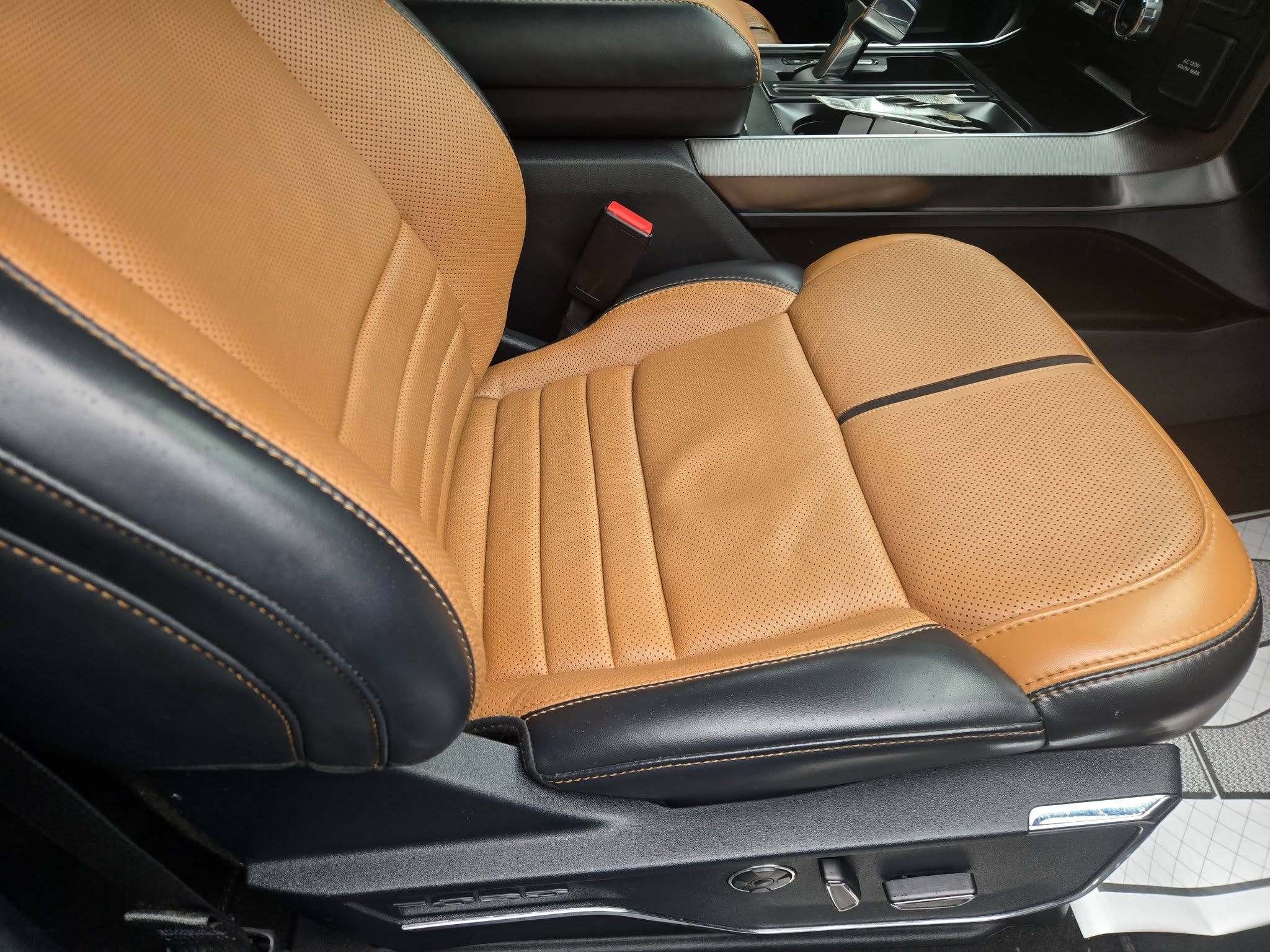 Spotless tan leather interior seat after a full interior detail